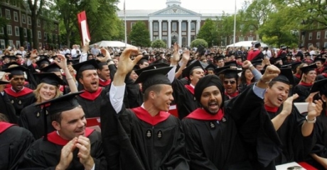 Harvard Business School students cheer during their graduation ceremonies in Boston
