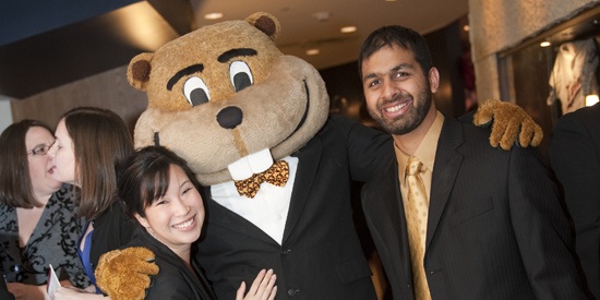 Students at the University of Minnesota's Carlson School of Management with "Goldy" 