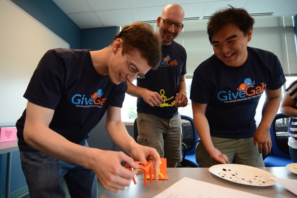 Cornell MBA Charlie Mulligan (center) created GiveGab, a social network for volunteers