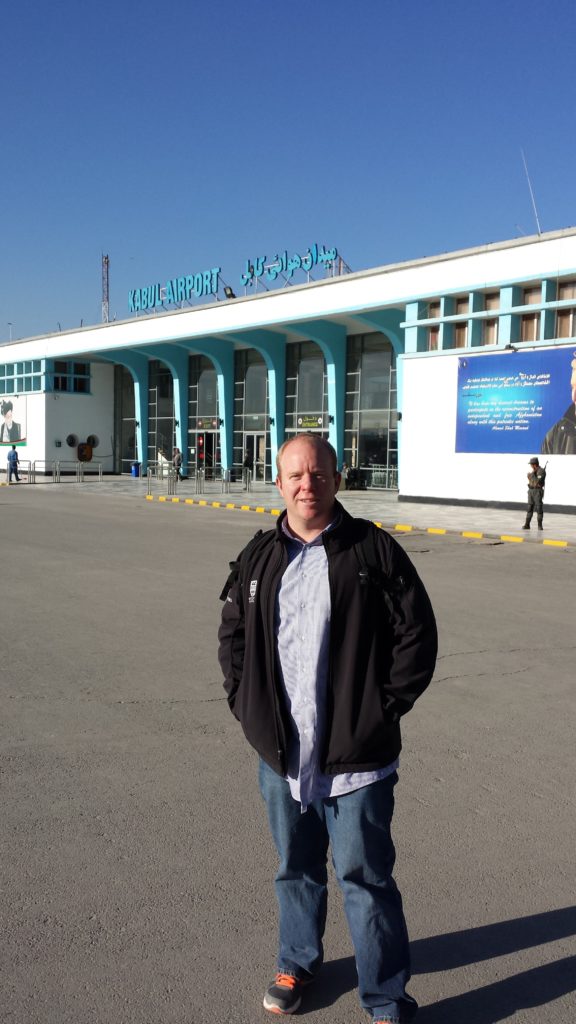 Image of Pete Gauthier in front of the Kabul Airport.