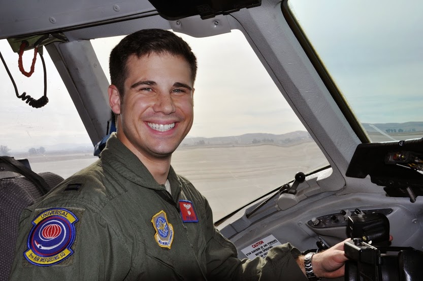 Photo of Benjamin Golata, student of Indiana University's Kelley Direct, in Air Force uniform inside the cockpit of a plane.