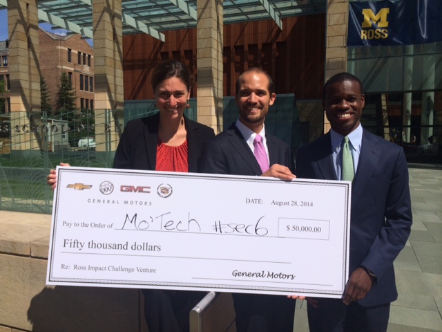Representatives from the winning team hold the $50,000 check. Students are Lily Hamburger, Giancarlo Moise and Lucius Clay. Read more about the Ross MBA orientation