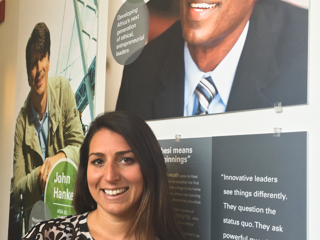 Haas MBA student Katie Benintende in front of school marketing posters   - Ethan Baron photo