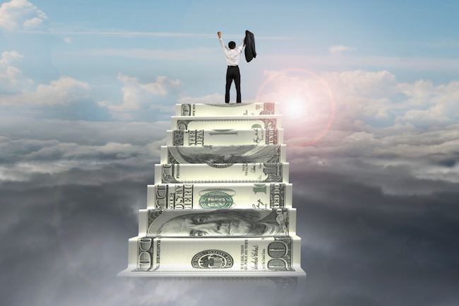 businessman cheer on top of money stairs with sunlight cloudscape