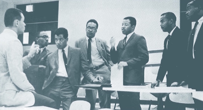 Six of IU's seven inaugural class members in a 1968 meeting with Dr. L. Richard Oliker, left, administrative director of the MBA progrm in 1968. Fourth from left, Vernon Mason. Courtesy photo