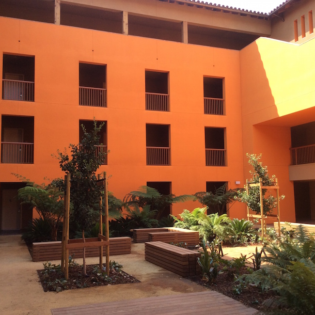 Kelly and George Davis Courtyard Reflecting signature Legorreta + Legorreta style, this colorful courtyard with landscaping is surrounded by resident rooms in the West Wing and features a bright exterior staircase that wraps around the courtyard. 