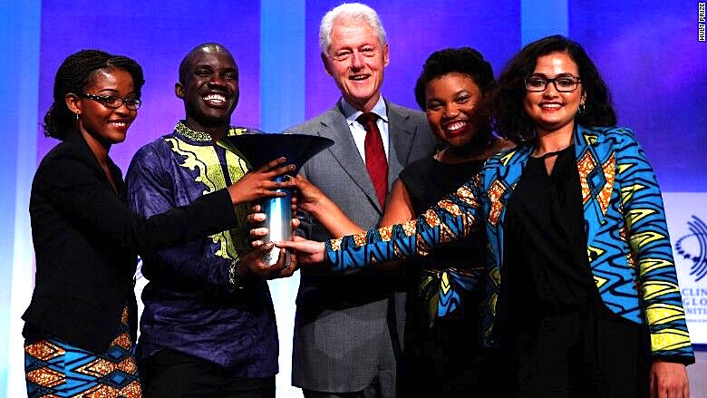 The Magic Bus Ticketing team wins the 2016 Hult Prize from President Bill Clinton. CEO Leslie Ossete, 21 (left), CFO Wyclife Omondi, 22, Chief Marketing Officer Iman Cooper, 23, and Sonia Kabra, 21.