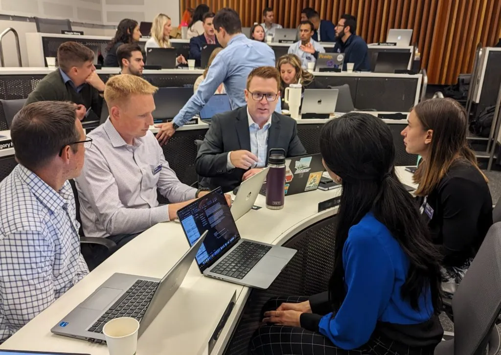 While about 95% of the Hybrid MBA at University of Washington’s Foster School of Business is online through its live virtual classrooms, it has in-person immersions at the start of each quarter on its Seattle campus. Here, Foster students work in teams on class assignments during one such immersion. Courtesy photo